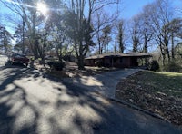 a house with a car parked in front of it