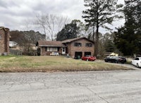 a house with a car parked in front of it