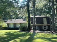 a house in the middle of a wooded area