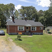 a house with a car parked in front of it