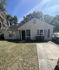 a house with a car parked in front of it